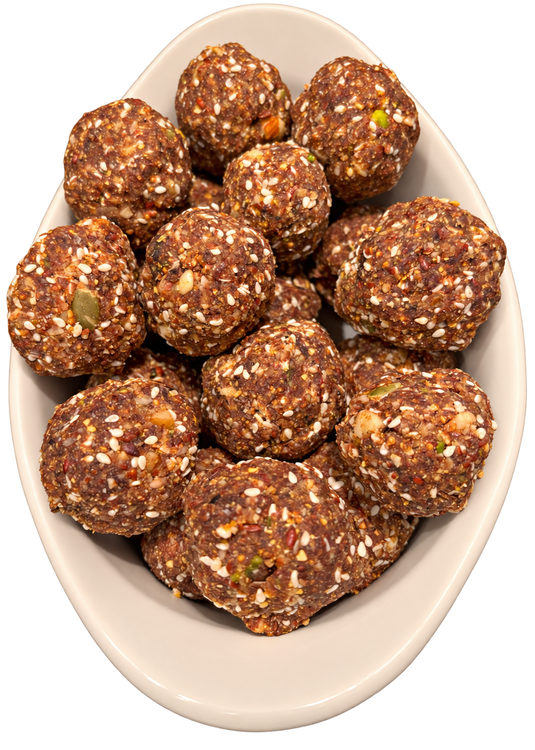 A bowl of homemade dry fruit laddoos with seeds and nuts on a transparent background